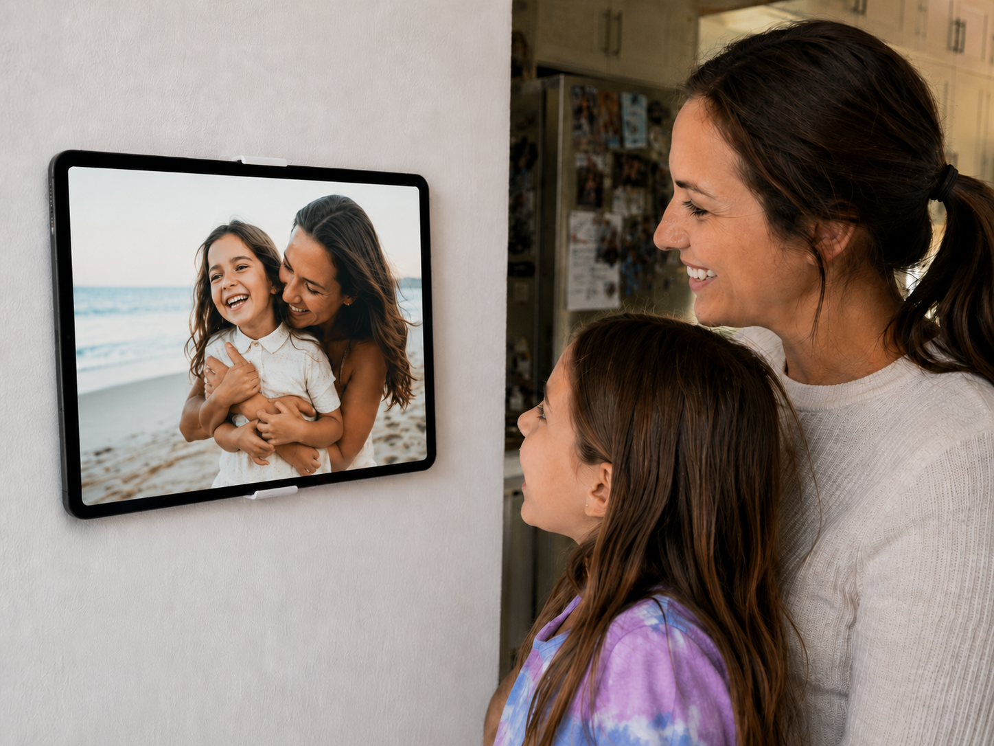 A wall tablet showing a full-screen photo slideshow.
